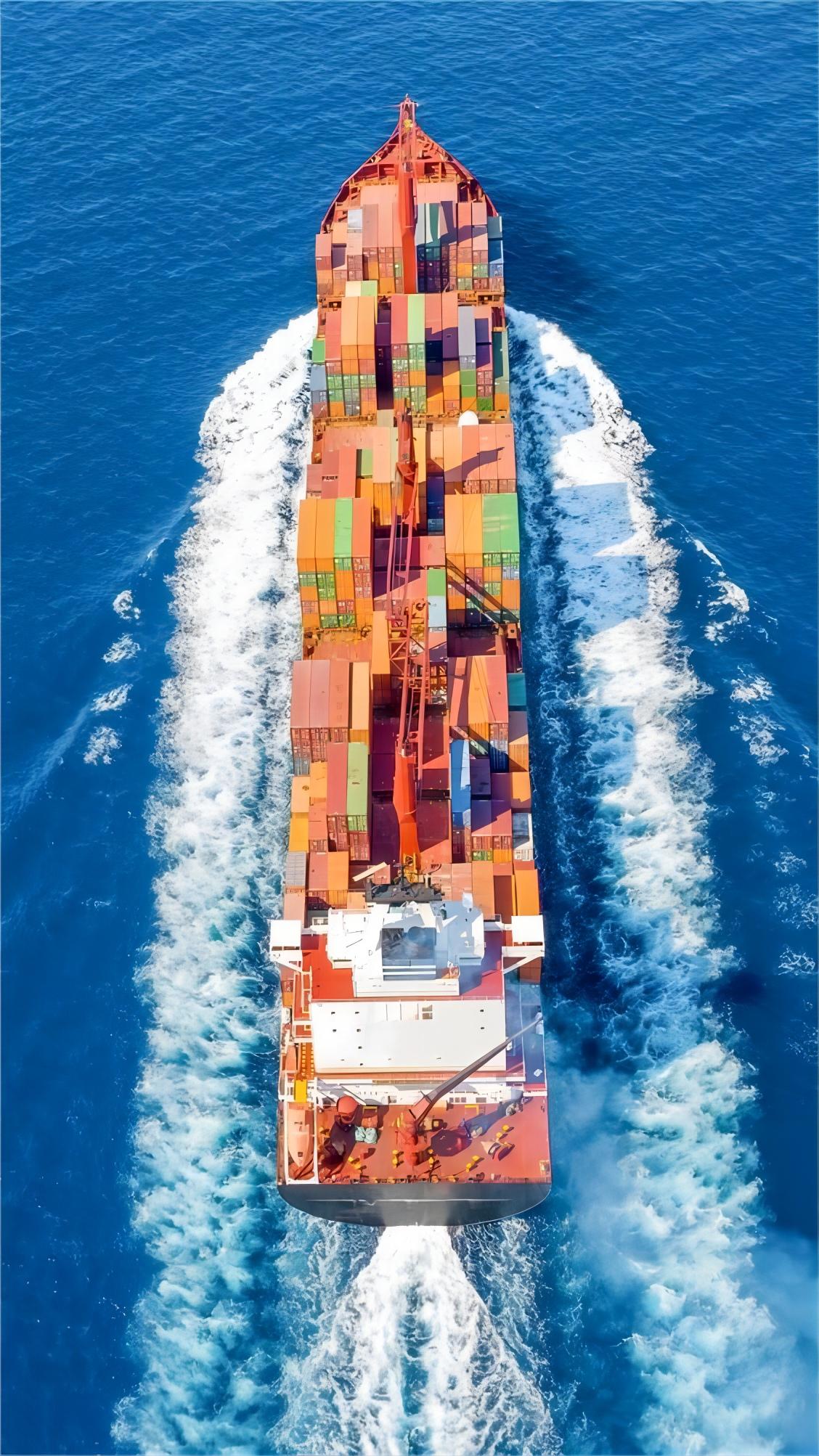 A large container ship departing a Chinese terminal for international waters