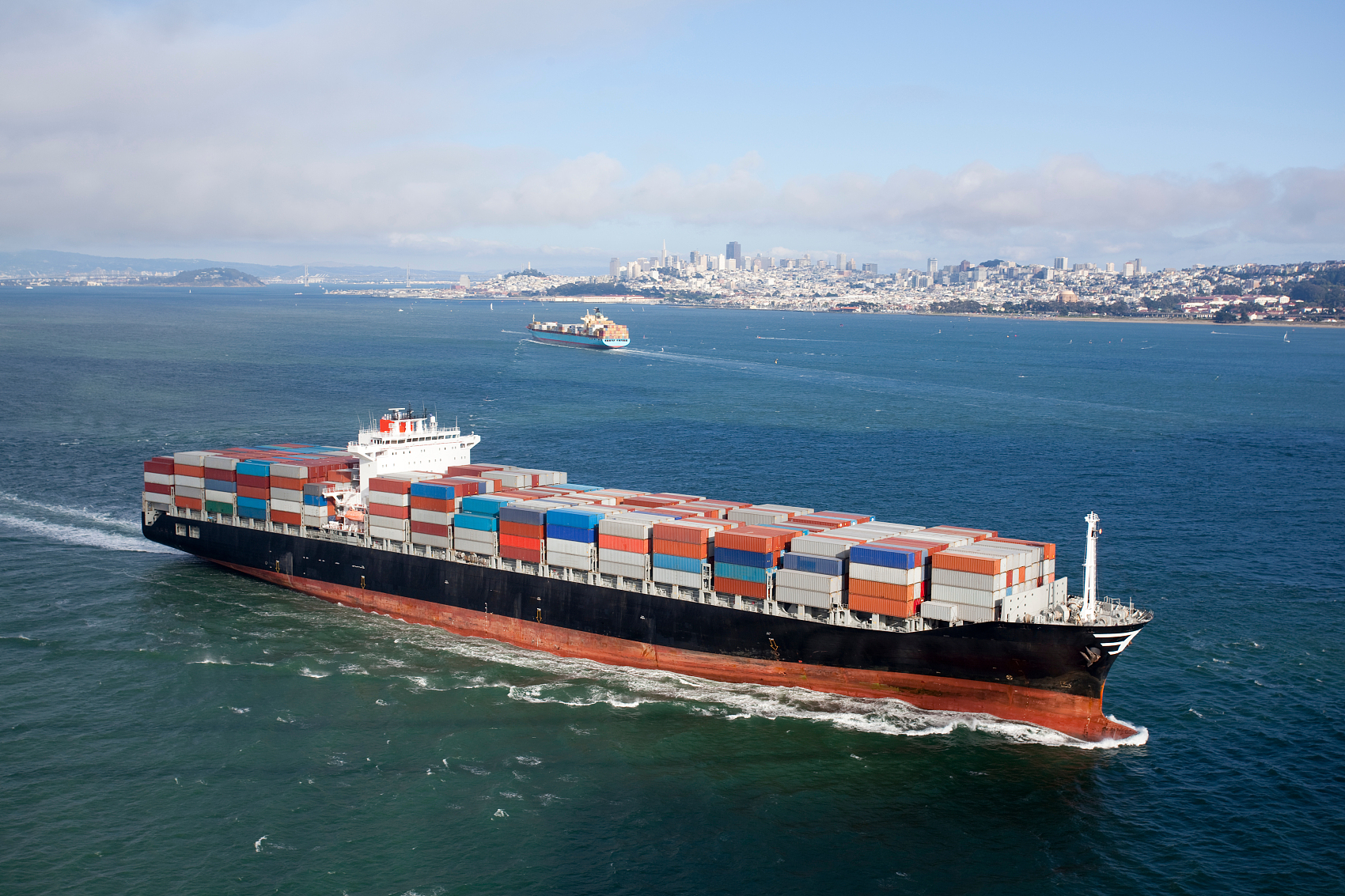 Cargo ship at a busy Chinese port representing freight forwarding services china